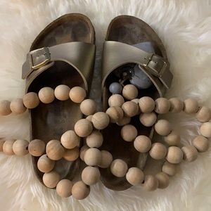 Gold strap Birkenstock sandals